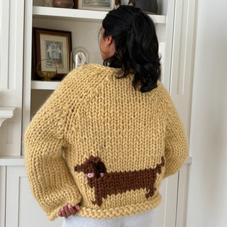 Pull en maille à grosses mailles et nœud avec épaules dénudées rouge