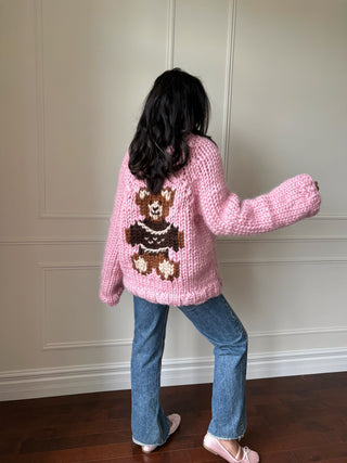 Pull en maille à grosses mailles et nœud avec épaules dénudées rouge